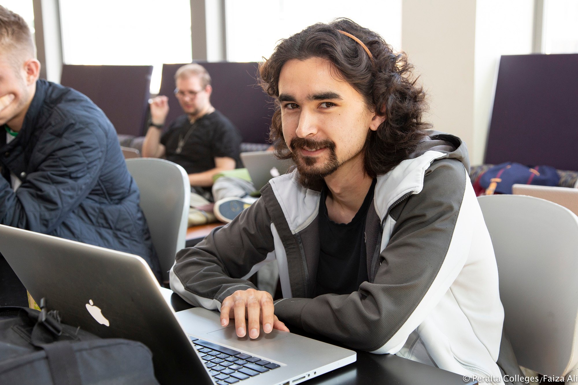 smiling-student-on-laptop