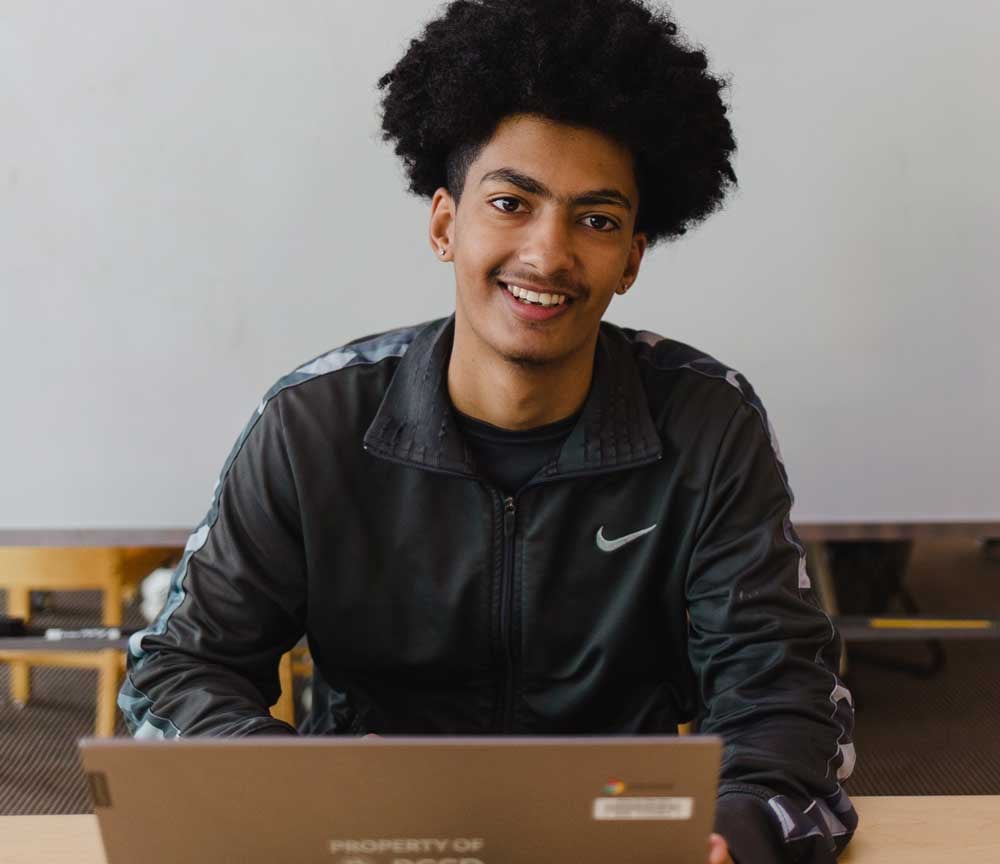 student-smiling-with-laptop