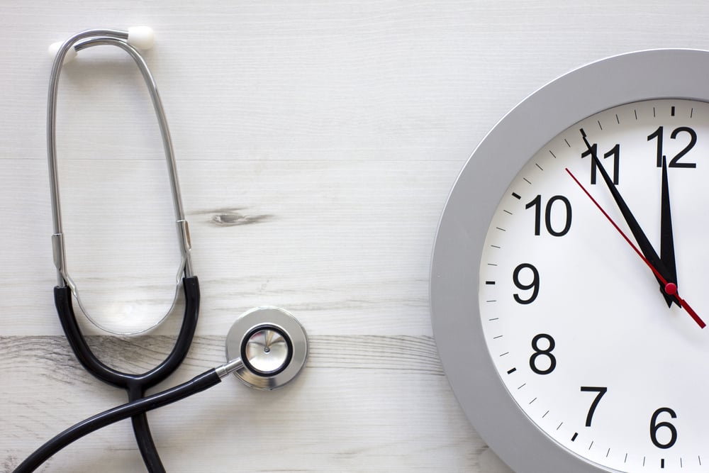 Concept showing doctors stethoscope and a clock face simulating an appointment